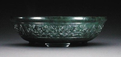 Marriage bowl with a band of archaistic phoenix and fish on four bracket feet by Chinese School